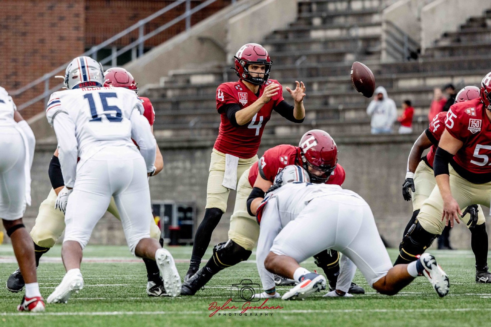 Coach coaching a quarterback